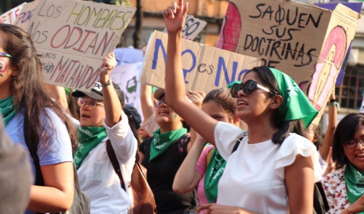 translated from Spanish: Green and purple tide takes streets of the CDMX