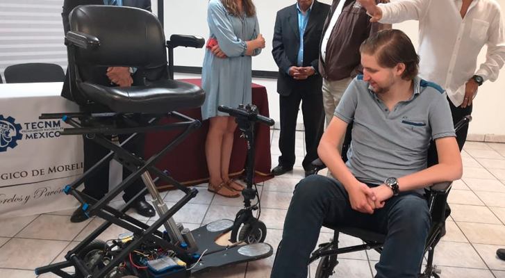 The ITM students present electric wheelchair people with muscular dystrophy