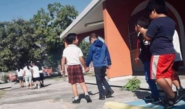 translated from Spanish: Child helps his friend blind in kindergarten