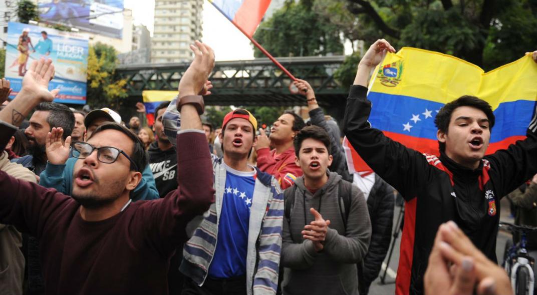 Two detainees and an injured man after a protest at the Venezuelan Embassy in Argentina
