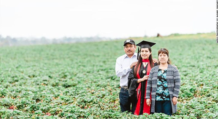 University of Mexican Origin takes photos of graduation in the field where their parents work, in the United States