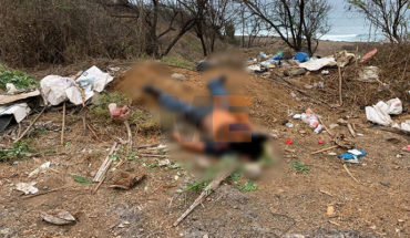 translated from Spanish: Body with bullet impacts is located on the road to Tecomán, Michoacán