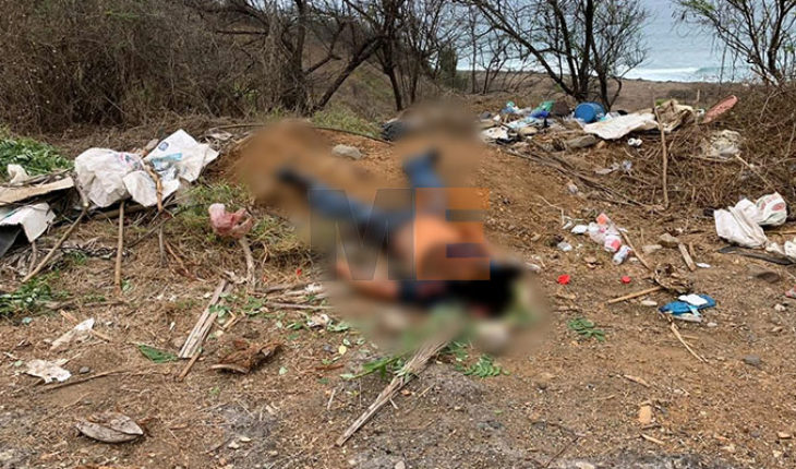 translated from Spanish: Body with bullet impacts is located on the road to Tecomán, Michoacán