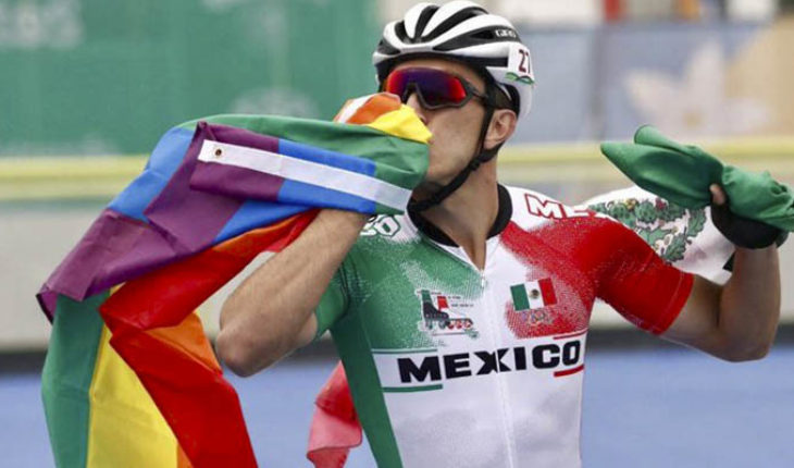 translated from Spanish: Mexican speed skater celebrates his bronze waving the gay flag