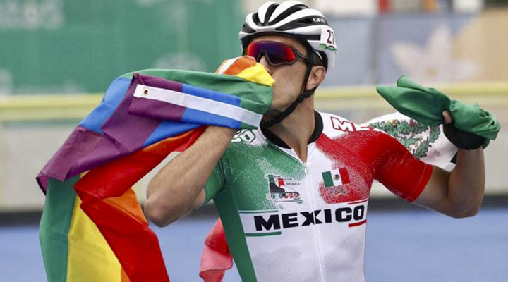 Mexican speed skater celebrates his bronze waving the gay flag