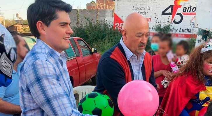 ECHR official exhibits Toño Ixtlahuac handing out toys
