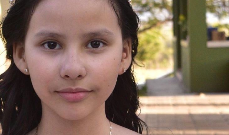 translated from Spanish: Maria Elisa performs the first communion