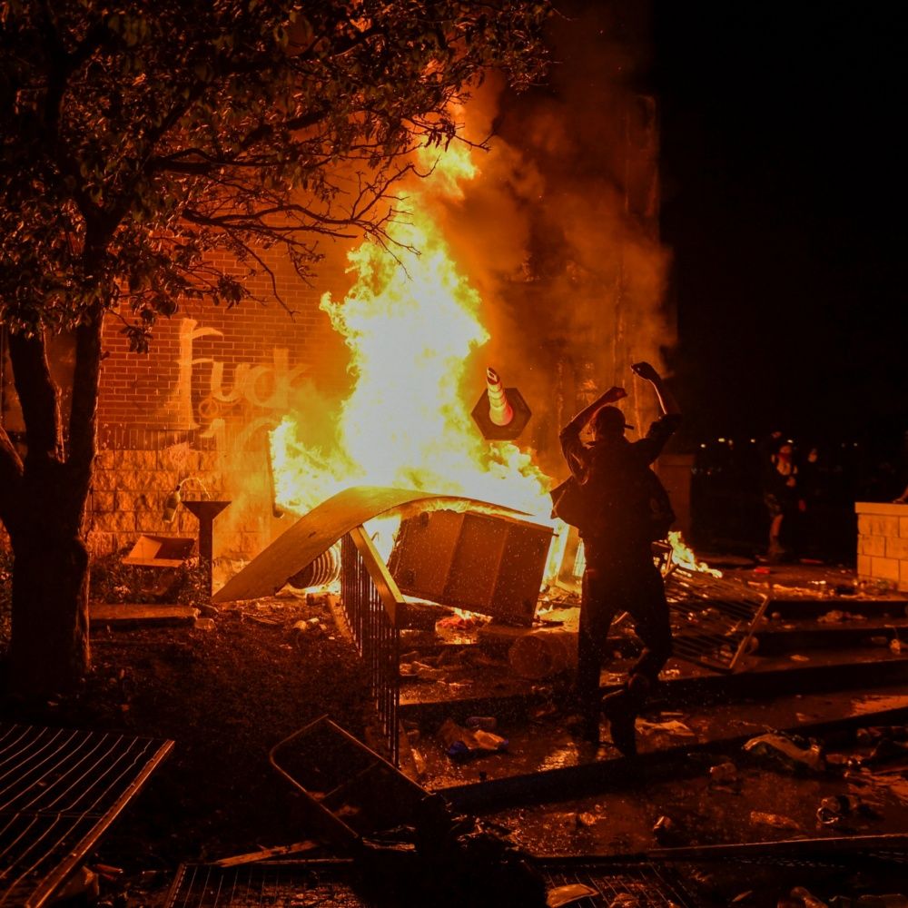 Burn police station during protests in Minneapolis, USA