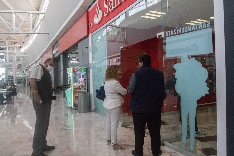 Santander cashiers hold user cards