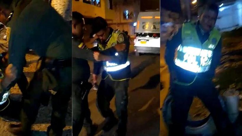 [VIDEO] Increíble "espectáculo" de dos policías ebrios en Colombia: chocaron vehículo oficial y fueron increpados por la gente