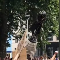 Demonstrators take down 17th-century slave trader statue in UK