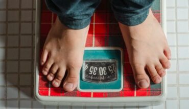 How does obesity psychologically impact adolescents?
